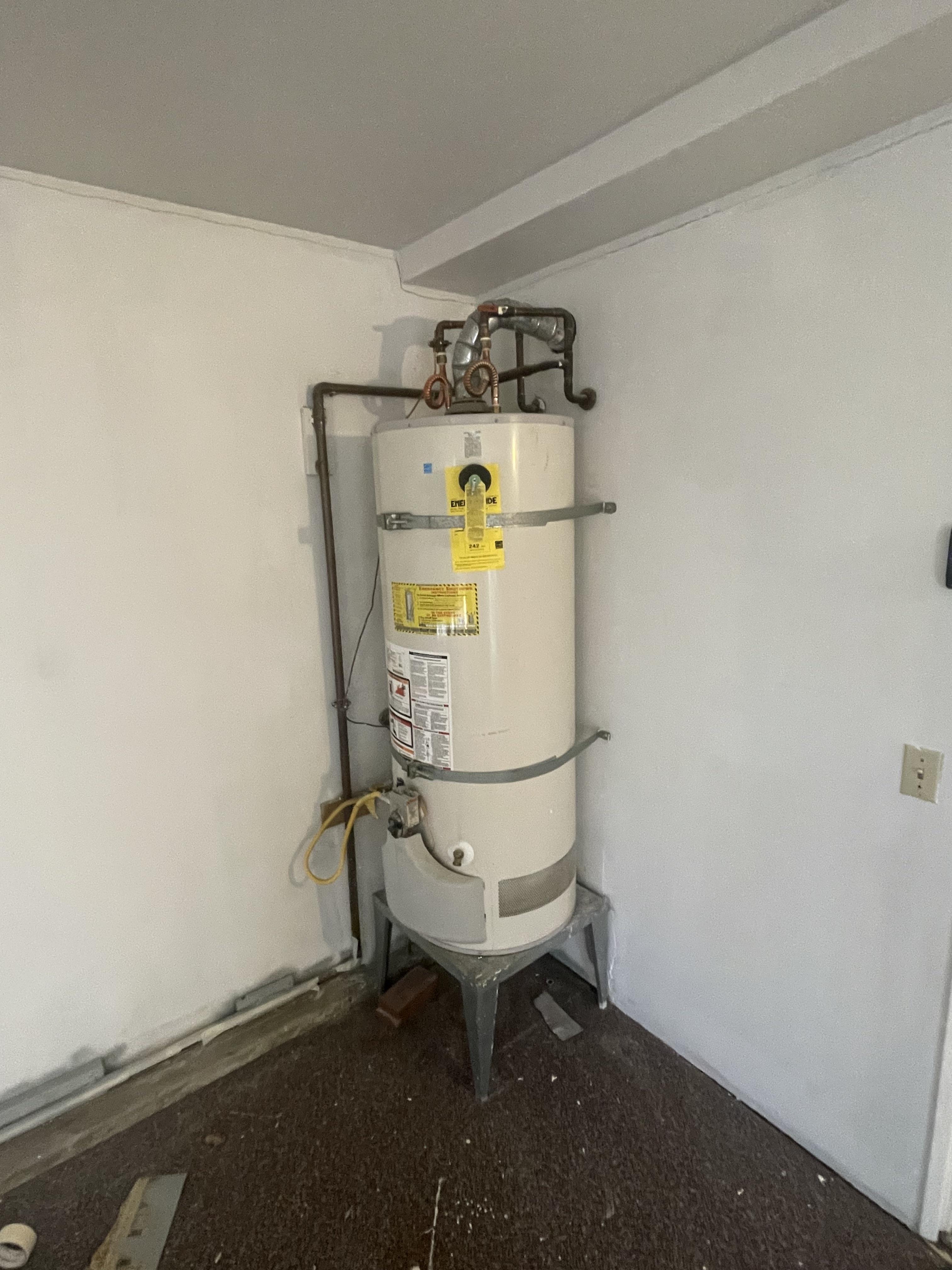 Plumber installing a water heater